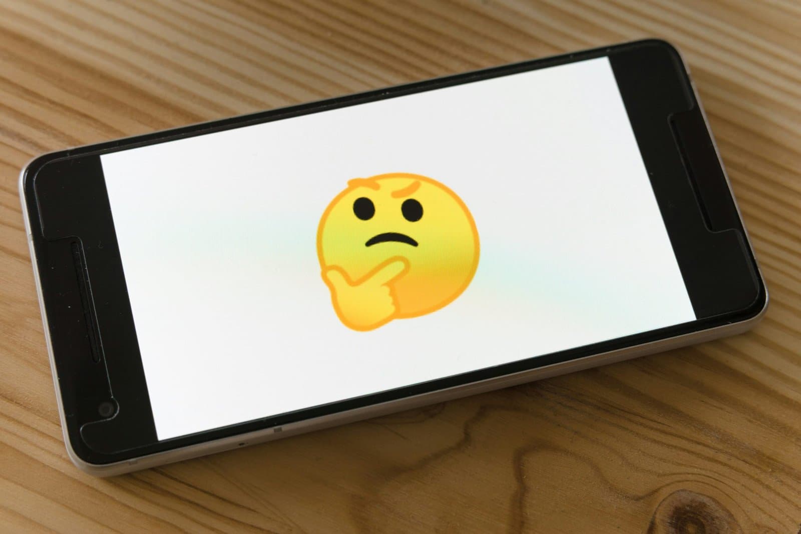 phone with thinking emoji